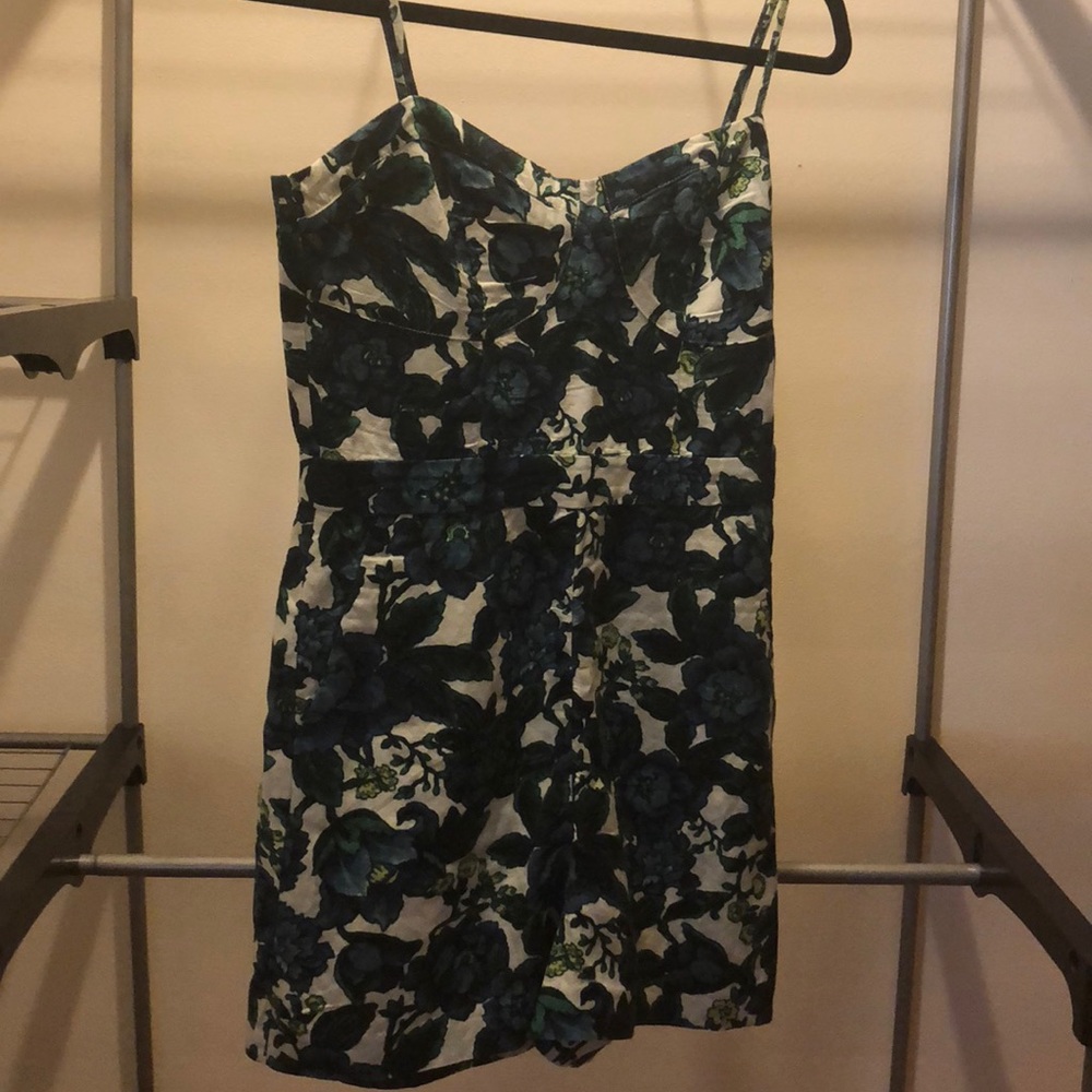 Never worn floral pattern romper with pockets!